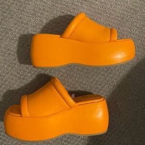 Orange platform slides.